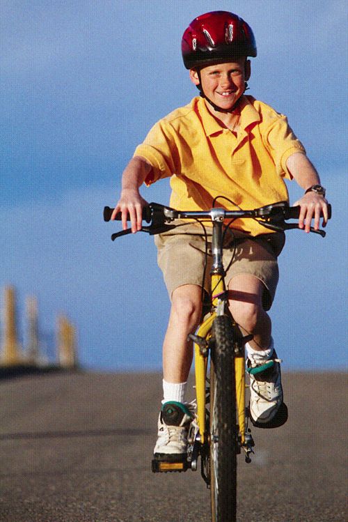 student riding bike